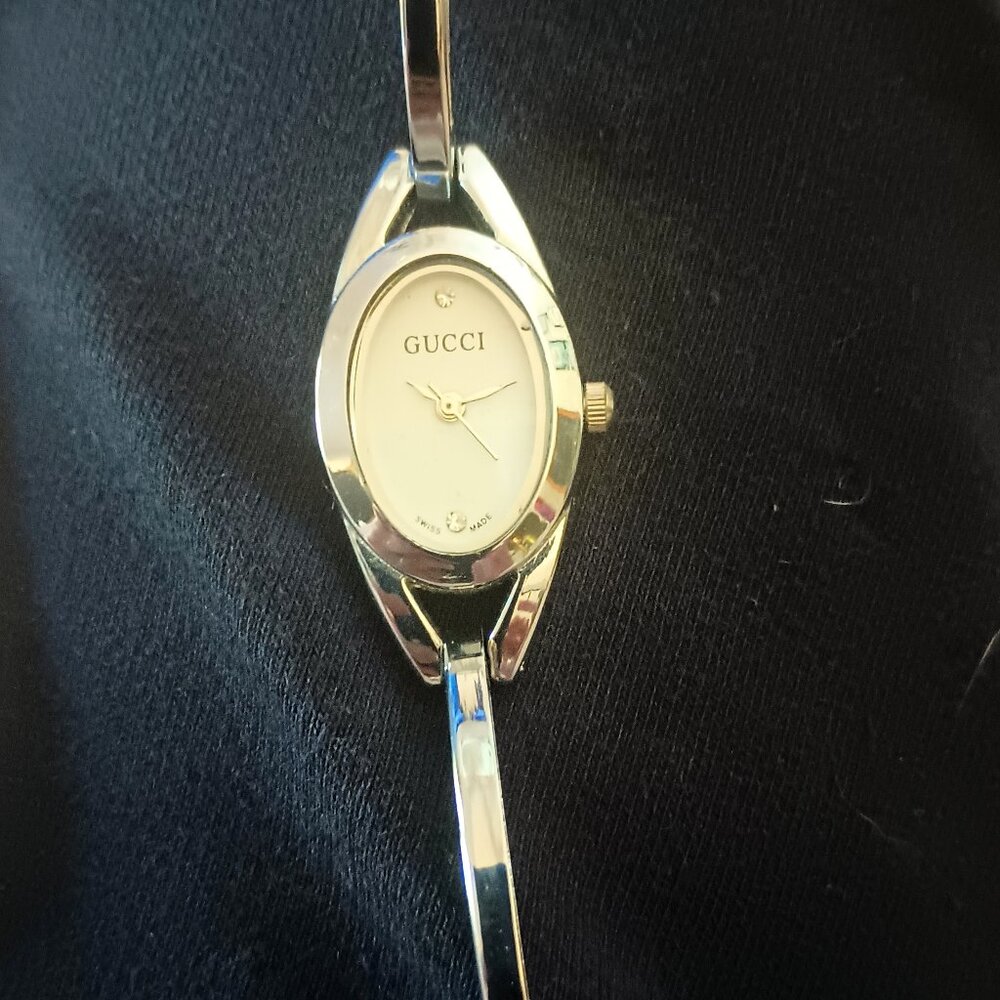 Gucci watch with two diamond chips